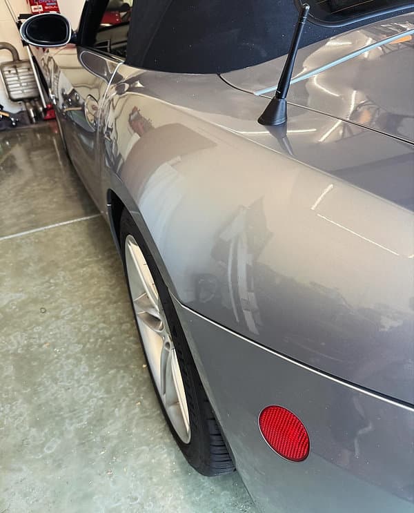 Paintless dent repair example after a door ding repair